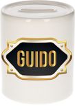 Bellatio Decorations Spaarpot met voornaam Guido - wit - met goud/zwart embleem - 8 x 9 cm - keramiek - met afsluitdop - cadeau verjaardag