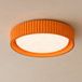 Lindby Plafonnier LED Colbie, orange nervuré, Ø 46 cm, à intensité variable