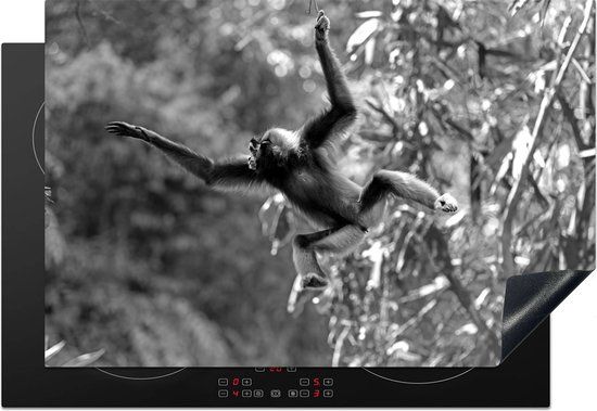 KitchenYeah® Inductie beschermer 77x51 cm - Springende aap in de jungle - zwart wit - Inductie kookplaat accessoire