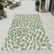 Tapis d'extérieur moderne, vert et blanc, avec motif de feuilles. Convient pour terrasse. Dimensions : 80 x 150 cm