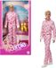 Ken Figurine in pink overalls, with sneakers and roller skates