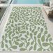 Tapis d'extérieur, vert et blanc à motif de feuilles, adapté pour balcon ou terrasse, dimensions : 140 x 200 cm