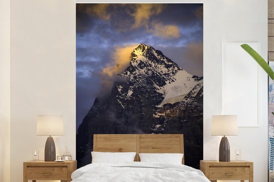 Nr1Wallpaper Behang - Fotobehang Bewolkte Eiger bij zonsondergang in Zwitserland - Breedte 155 cm x hoogte 240 cm