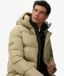 Superdry Middellange Sport Pufferjas met Capuchon Heren Gewatteerde Jassen