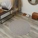 Rond tapijt, glad, beige, ivoor. Tapijt van natuurlijke wol. Diameter 100 cm.