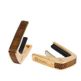 Thalia Premium Series Capodaster met gouden afwerking en inleg van gekrulde Hawaiiaanse koa in honingraatpatroon