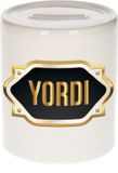 Bellatio Decorations Shoppartners Bv Spaarpot met voornaam Yordi - wit - met goud/zwart embleem - 8 x 9 cm - keramiek - met afsluitdop - cadeau verjaardag