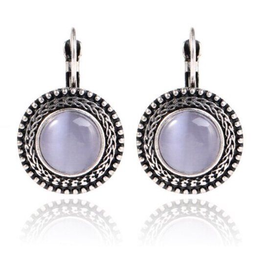 Deja Jewels Lookinggoodtoday Ronde zilverkleurige dames oorbellen met paarse opaal