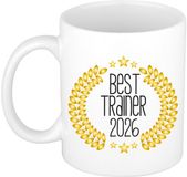 Bellatio Decorations Cadeau koffie/thee mok - de beste trainer van 2026 - wit - 300 ml - keramiek