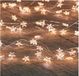 Anna's Collection Guirlande lumineuse - 20 LED lampes - Étoiles - Blanc chaud - 100 cm - Piles - Minuterie - Fil argenté