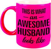 Bellatio Decorations Bol This is what an awesome husband looks like cadeau mok / beker - 330 ml - neon roze - verjaardag / Vaderdag