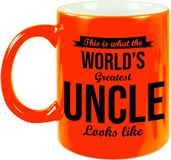 Bellatio Decorations Oom cadeau mok / beker This is what the worlds greatest uncle looks like - neon oranje - verjaardag / bedankje