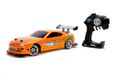 Jada Toys Fast & Furious Drift 1995 Toyota Supra, Turbo, driftfunctie, 4-wielaandrijving, auto met afstandsbediening, 2 kanalen, USB-oplaadfunctie, 4 reservebanden, 1:10, oranje