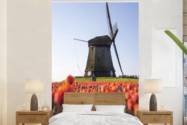 Nr1Wallpaper Behang - Fotobehang Een molen met tulpen - Breedte 200 cm x hoogte 300 cm