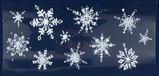 Merkloos Kerst raamversiering raamstickers witte glitter sneeuwvlokken 23 x 49 cm