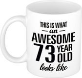 Bellatio Decorations Shoppartners Bv This is what an awesome 73 year old looks like - cadeau koffiemok - beker - 300 ml - verjaardag 73 jaar - kado mok / beker