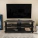 Hanah Home Industriële tv-standaard, zwart en antraciet, 120 x 44,6 x 47,4 cm, 100% melamine gecoat deeltjesbord, 18 mm dik, stijlvol en duurzaam, voor moderne woonruimtes