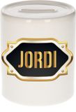Bellatio Decorations Shoppartners Bv Spaarpot met voornaam Jordi - wit - met goud/zwart embleem - 8 x 9 cm - keramiek - met afsluitdop - cadeau verjaardag