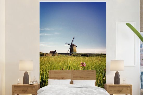 Nr1Wallpaper Behang - Fotobehang Een molen met bloemen - Breedte 200 cm x hoogte 300 cm