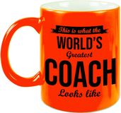 Bellatio Decorations Bol.com What the worlds greatest coach looks like mok - cadeau mok/beker - neon oranje - 330 ml - trainer bedankt cadeau