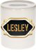 Bellatio Decorations Shoppartners Bv Spaarpot met voornaam Lesley - wit - met goud/zwart embleem - 8 x 9 cm - keramiek - met afsluitdop - cadeau verjaardag