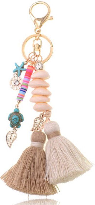 Deja Jewels Lookinggoodtoday Handgemaakte Ibiza sleutelhanger goudkleurig beige bruin met schelpjes