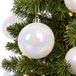 Decoris Kerstballen - 24x st - wit parelmoer - 10 cm - kunststof - kerstversiering