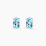 Boucles d'oreilles puce ovale serti griffe or blanc topaze