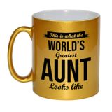 Bellatio Decorations This is what the worlds greatest aunt looks like cadeau koffiemok / theebeker - goudkleurig - 330 ml - verjaardag / bedankje