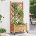 Maison Exclusive - Jardinière sur roulettes, en bois massif de sapin brun