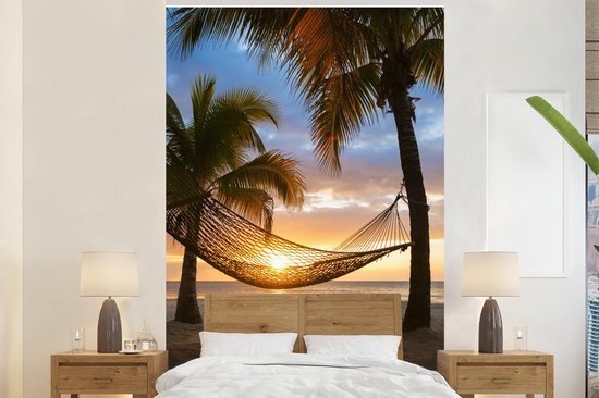 Nr1Wallpaper Behang - Fotobehang Zonsondergang - Hangmat - Palmboom - Breedte 155 cm x hoogte 240 cm