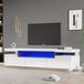 Meuble TV 160x39x42, laqué brillant, avec éclairage LED en 16 couleurs, adapté pour un téléviseur de 70 pouces, avec 3 tiroirs