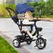 Tricycle with push bar and swivel seat