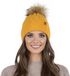 Vivisence Dames Wintermuts - Zacht Gebreid Materiaal met Modieuze Steek en Pompon Van Imitatiebont - Warme Fleece Voering voor Comfort Pasvorm en Minder Statisch Haar tijdens Koude Winterdagen - Honingkleurig