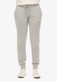 Superdry Luxe slimfit joggingbroek met metallic logo Dames Pumice Stone Beige Marl XS