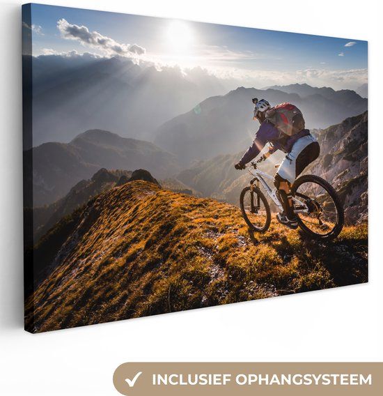 OneMillionCanvasses Canvas schilderij - Bergen - Fietser - Zon - Sport - 120x80 cm