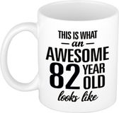 Bellatio Decorations Shoppartners Bv This is what an awesome 82 year old looks like - cadeau koffiemok - beker - 300 ml - verjaardag 82 jaar - kado mok / beker