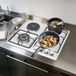 Inox gazinière avec 4 brûleurs, adapté pour un usage domestique et pour camping-cars