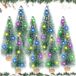 Merkloos / Sans marque BeiJingLiangPinJiaZuoKeJiWenHuaFaZhanYouXianGongSi Mini Christmas Tree 9 Pieces Green Pine Tree Decoration Small LED Artificial Pine Tree with Wooden Base Snow Effect Christmas Party Crafts Table Decoration