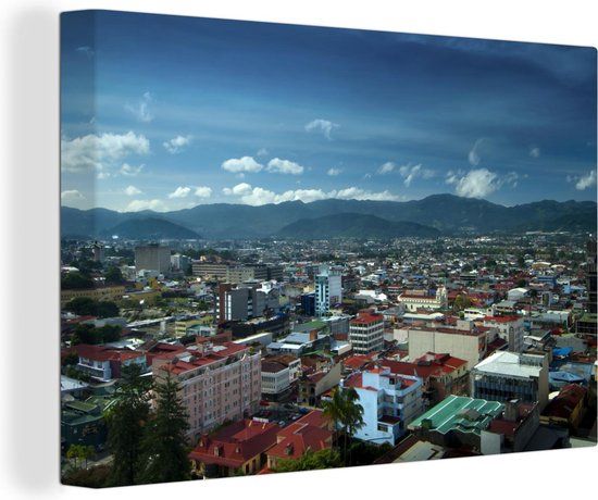 OneMillionCanvasses Canvas schilderij 150x100 cm - Donkerblauwe lucht boven San José in Costa Rica - Multicolor