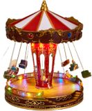 Merkloos / Sans marque Koopman International Kerstdorp draaiende zweefmolen - LED verlichting - Beweging - Muziek - 27 x 21 cm