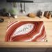Merkloos KitchenYeah® Inductie beschermer 77x51 cm - Close-up van een rood met witte agaat - Inductiebeschermer voor Inductie Kookplaat