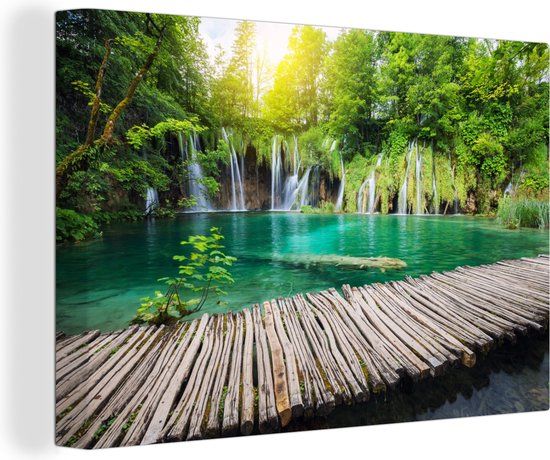 OneMillionCanvasses Canvas schilderij - Brug - Waterval - Bomen - Tropisch - 150x100 cm