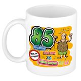 Bellatio Decorations cadeau mok 85 jaar - daar gaan je wilde haren - keramiek - 300 ml