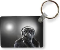 Merkloos / Sans marque TheKeyMeister B.V. Sleutelhanger - Chimpansee - Koptelefoon - Camera - Uitdeelcadeautjes - Plastic