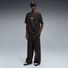 PUMA Wide Graphic broek Uniseks, Zwart, Maat XL