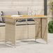 Maison Exclusive Table de jardin exclusive, avec plateau en bois, couleur beige, dimensions 110x68x70 cm, en polyrotin
