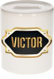 Bellatio Decorations Shoppartners Bv Spaarpot met voornaam Victor - wit - met goud/zwart embleem - 8 x 9 cm - keramiek - met afsluitdop - cadeau verjaardag