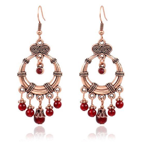 Deja Jewels Lookinggoodtoday Ronde Goudkleurige Bohemian dames oorhangers met details en rode kralen