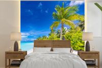 Merkloos / Sans marque Nr1Wallpaper B.V. Fotobehang Strand - Palm - Hangstoel - Breedte 350 cm x hoogte 350 cm